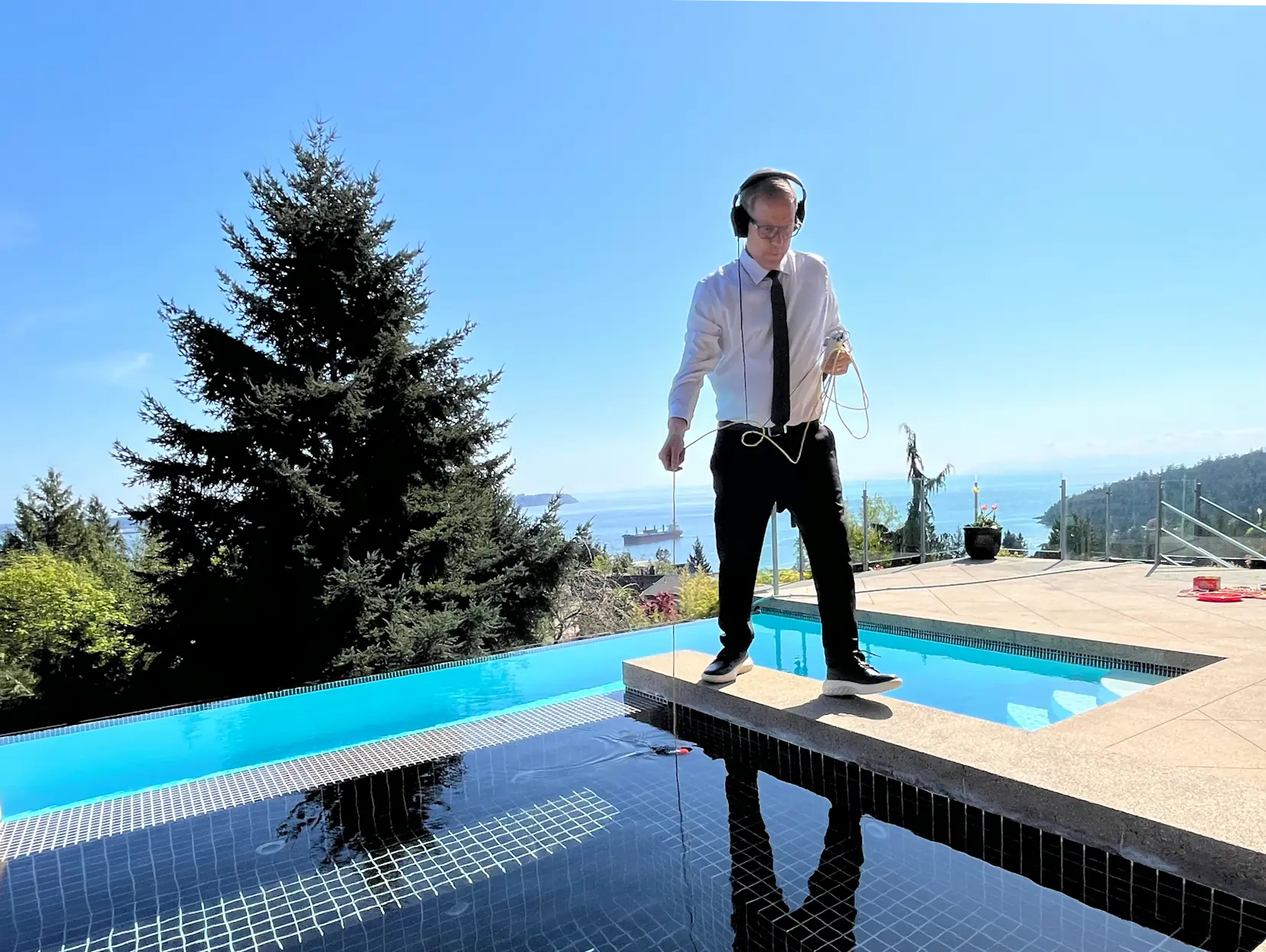 Black Tie Pools technician performing pool leak detection