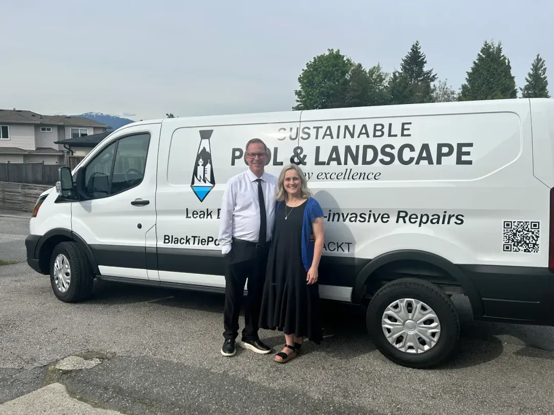 Russell and Lisa Mackay standing in front of a Black Tie service van